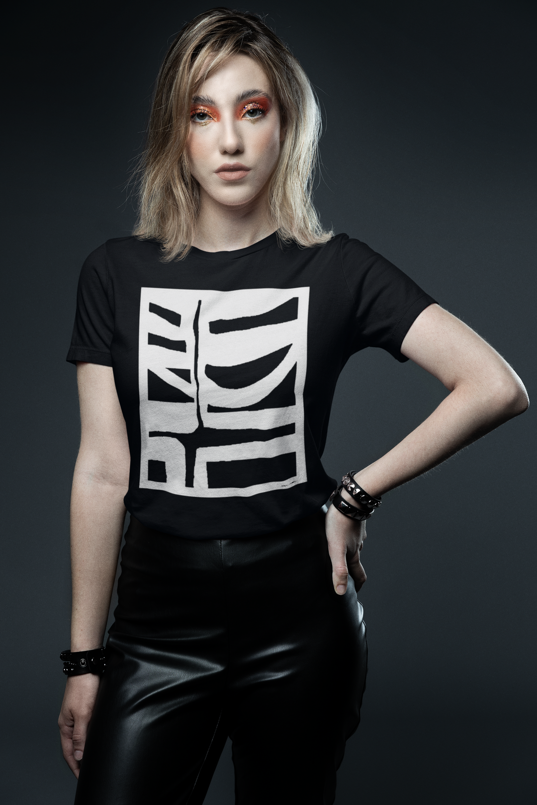 woman with graphic makeup inspired by a glam rock aesthetic wearing abstract t-shirt BI-500 in white