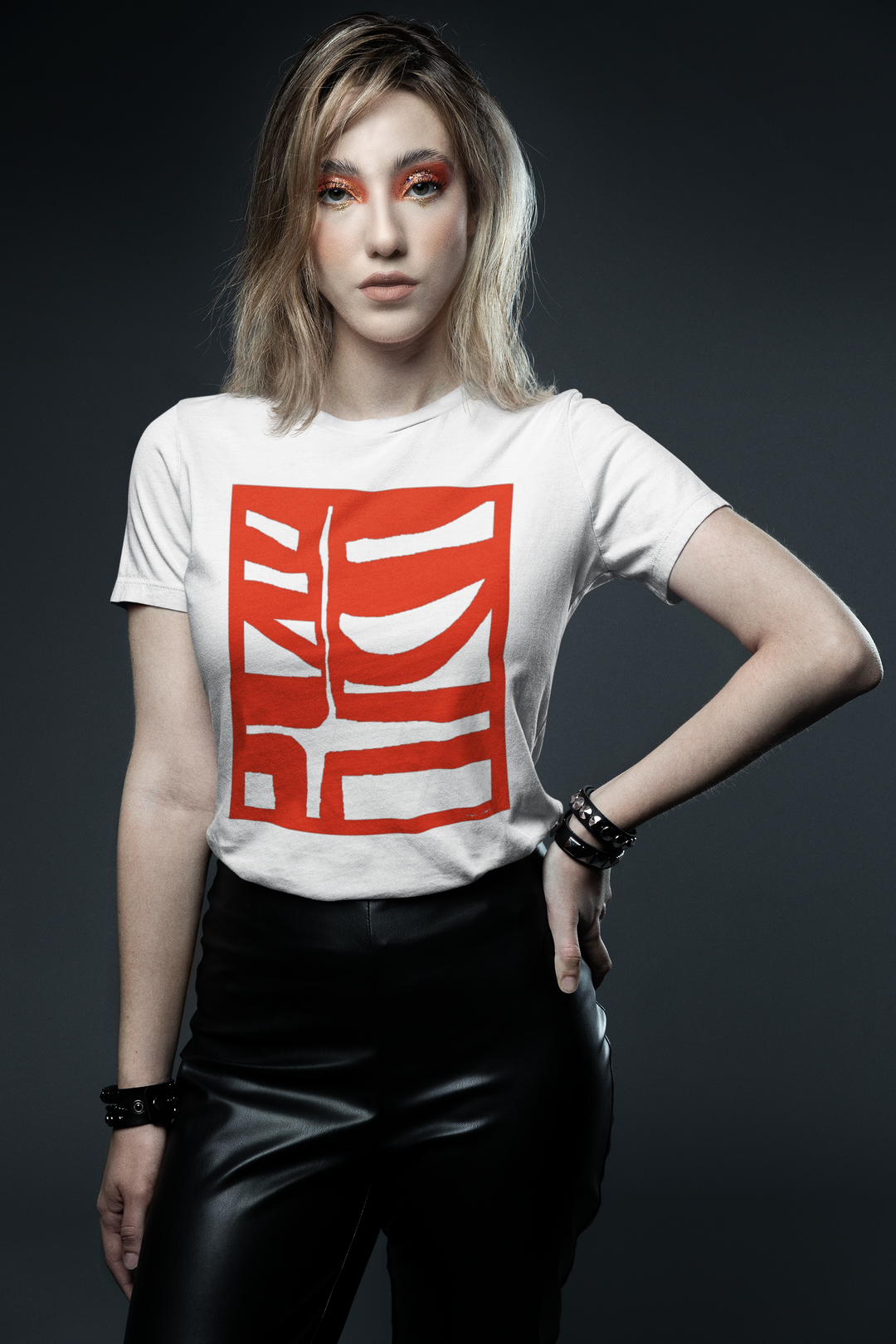 woman with graphic makeup inspired by a glam rock aesthetic wearing abstract t shirt BI 500 in Red 